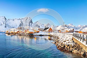 Fabulous winter view of Sakrisoy village and snowy mountaines on background