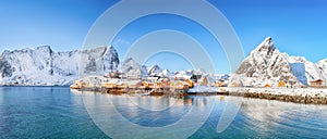 Fabulous winter view of Sakrisoy village and snowy mountaines on background