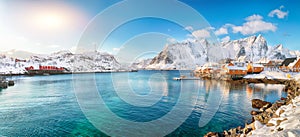 Fabulous winter view of Sakrisoy village and snowy mountaines on background