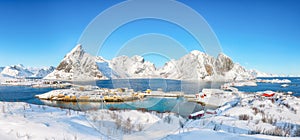 Fabulous winter view of Sakrisoy village and snowy mountaines on background