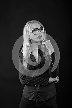 Fabulous young lady with straight hair in eyewear and blouse