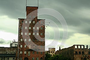 Facade of an Abandoned factory and warehouse with its distinctive red brick decayed buildings in Central and Eastern Europe