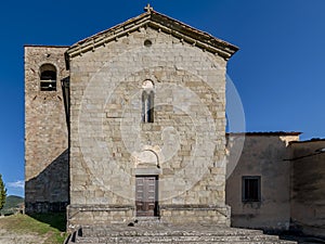 The facade of the ancient parish church of San Giovanni Evangelista in Montecuccoli in Valdibure, Pistoia, Italy