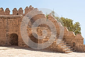 Facade of ancient stone castle and fortress