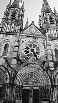 The facade of the Anglican Cathedral of Saint Fin Barre\'s in Cork, Ireland. Black and white image. Monochrome