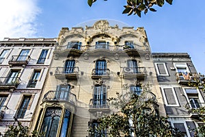 Facade of an apartment building in Modernismo style in Gracia, Barcelona, Spain photo