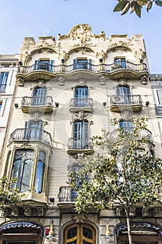 Facade of an apartment building in Modernismo style in Gracia, Barcelona, Spain photo