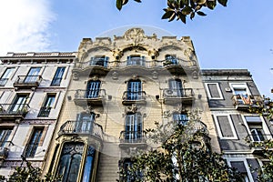 Facade of an apartment building in Modernismo style in Gracia, Barcelona, Spain photo