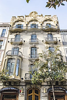 Facade of an apartment building in Modernismo style in Gracia, Barcelona, Spain photo