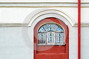 Facade with arched window