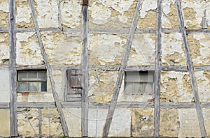 Facade and background of an old, weathered half-timbered house in Germany