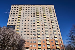 The facade with balconies of a residential high-rise building in Poznan