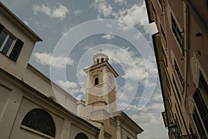 Facade of Basilica di Santa Maria di Nazareth across the blue sky from beneath in Sestri Levante, Liguria, Italy photo