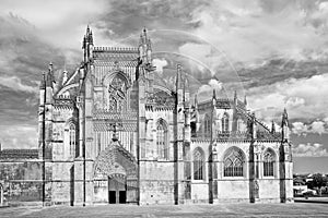 The facade of Batalha cathedral in Portugal with the ornate facade in manueline style