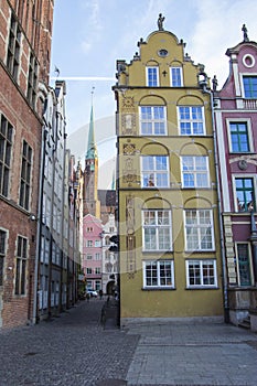 The facade of the beautiful historic building on the street of the Old Town of Gdansk. Poland.