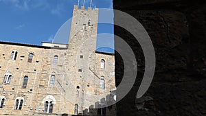 The facade of the beautiful medieval building, the Palazzo Pretorio in Volterra.