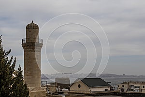 Facade of the Beyler mosque and minaret in Baku, Azerbaijan photo