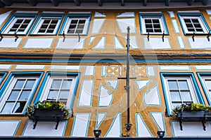 Facade of a blue half-timbered house