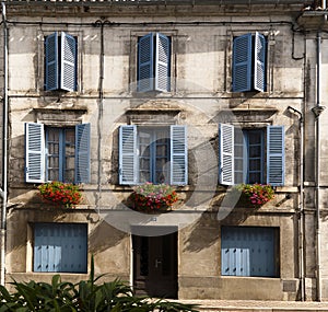 Facade blue windows flowers Brantome France