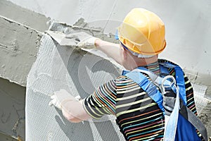 Facade builder plasterer at work