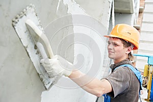 Facade builder plasterer at work