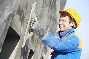 Facade builder plasterer at work photo