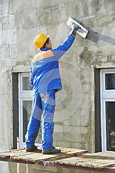 Facade builder plasterer at work