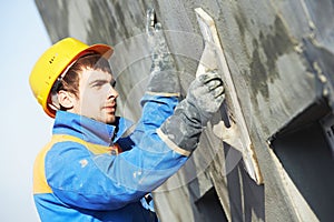 Facade builder plasterer at work