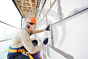 Facade builder plasterer at work