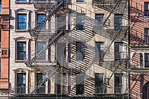 Facade of building on 5 avenue in new york, with fire stairs.