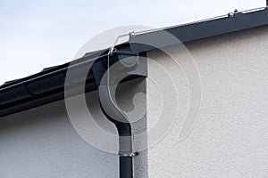 facade of a building with detailed handcrafted sheet metal plumber work, gutter, downpipe and lightning protection