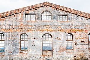 The facade of the building of an old glass factory of the 19th century, built in the Baroque style in the Siberian outback in the