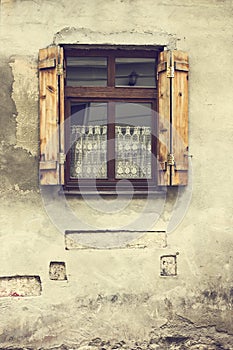 The facade of the building, the old house, the windows in the house