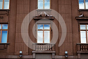 facade of a building with windows, the sky is reflected in the windows
