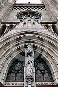 Facade of Cathedral of Saint Mary of the Assumption. Marble Gothic church with Saint Mary sculpture in the front