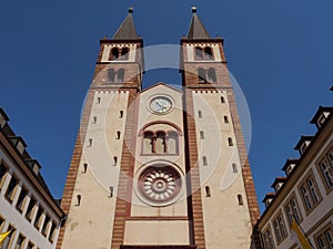 Facade of a cathedral of St. Kilian under the blue sky in Wuerzburg, Germany