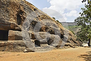 Facade of a Cave 12 Vihara showing Stairs, Cell Doors with rock-cut, Ancient Buddhist built in 2nd century BC, during the Hinayana