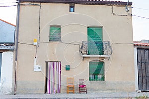 Facade of centennial house in Castilian town in Spain