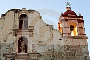 Facade of the church Iglesia Preciosa Sangre de Cristo with its beautiful bell tower and ornaments, Oaxaca, Mexico photo