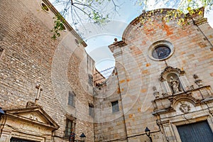 Facade of the church and Placa de Sant Felip Neri in Barcelona photo