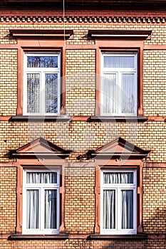 facade of classicistic house with brick wall