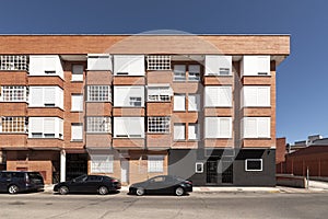 Facade of a clay brick colored residential building