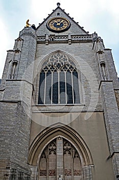 Facade and clock of the medieval Saint Peters church in Leuven,