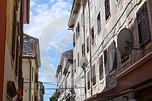 Facade of colorful buildings in a street in the old town of Pula, Croatia