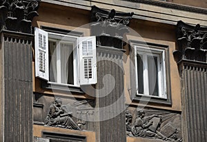 Facade with columns, reliefs, windows on Corso Italia, Trieste. photo