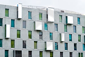 Facade of the contemporary, Art Otel in the city of Cologne, Germany, Green, blue and turquoise coloured windows