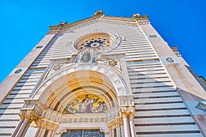 The facade decorations of Famedio, the main entrance to Monumental Cemetery of milan, Italy