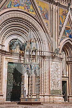 Facade details of the opulent and monumental Orvieto Cathedral in Orvieto.