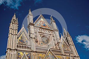 Facade details of the opulent and monumental Orvieto Cathedral in Orvieto.