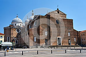 Facade and domes of the medieval Basilica de Santa Justina church in the city of Padua photo